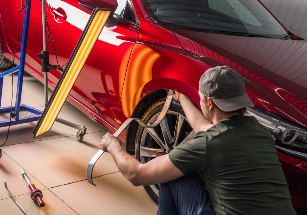 Removing dents on a car body without painting. PDR. High quality photo